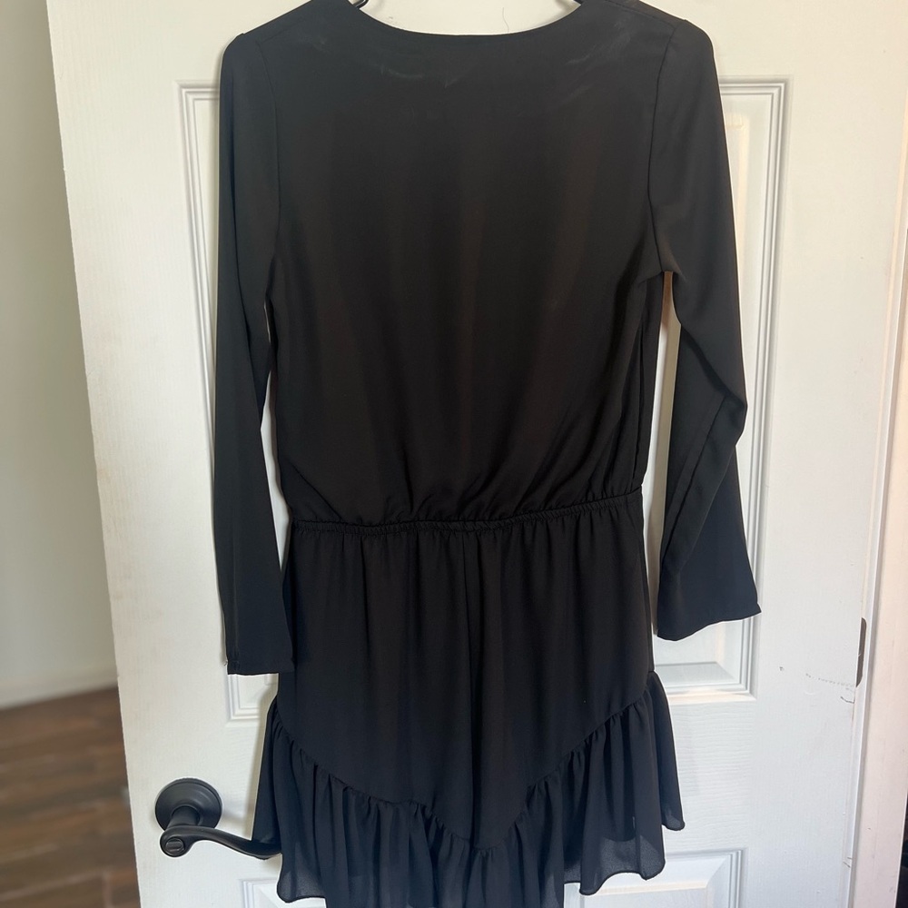 Black long sleeve ruffle romper (small)